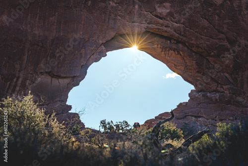sun breaking through window arch in arches nationalpark in utah usa