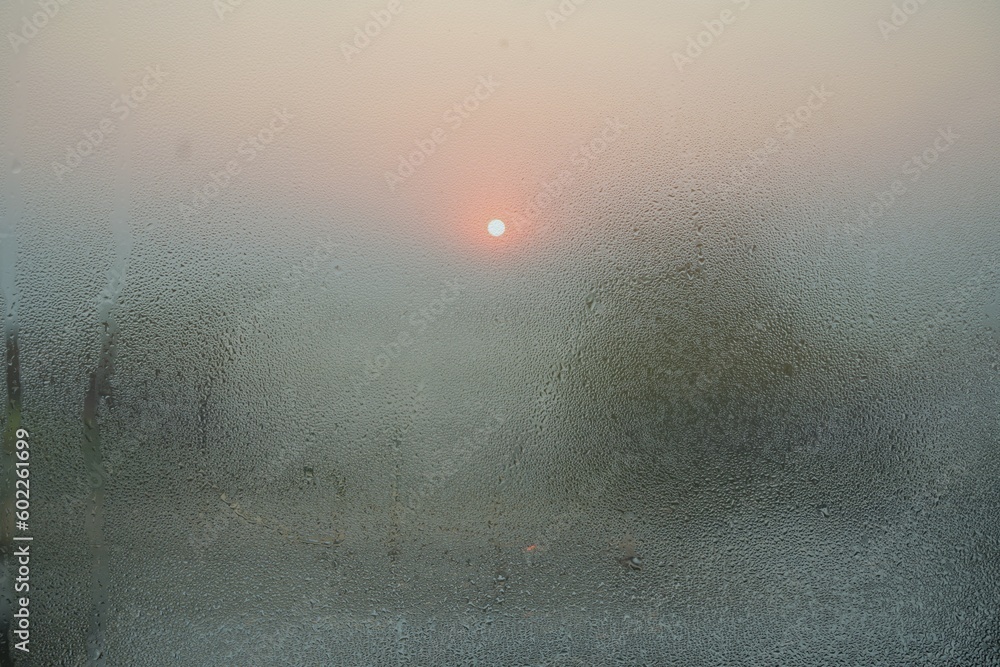 Double exposure, sunset and steam on glass Double exposure, sunset and steam on glass