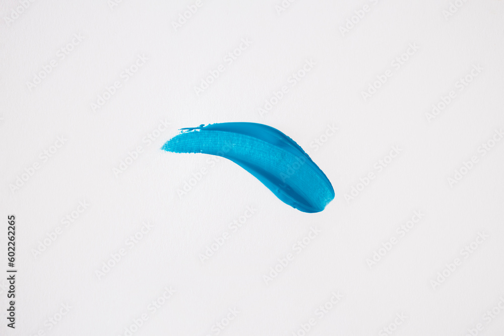 Blue smear on a white background. Top view, flat lay Blue smear on a white background. Top view, flat lay