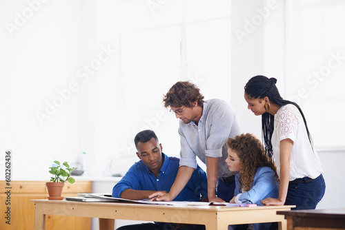 Businessman, coaching and paperwork in meeting for planning, team strategy or training staff at the office. Business people with coach and document in teamwork for group project or plan at workplace
