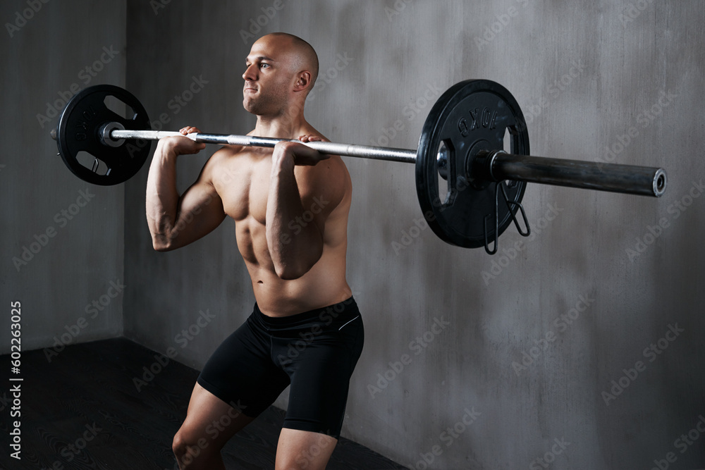 Fitness, man and weightlifting with barbell for workout, exercise or training at the gym. Fit, active and strong muscular male lifting weight for intense strength exercising, power or bodybuilding Fitness, man and weightlifting with barbell for workout, exercise or training at the gym. Fit, active and strong muscular male lifting weight for intense strength exercising, power or bodybuilding