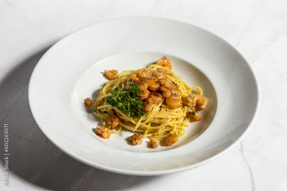 Pasta with prawns served on a plate