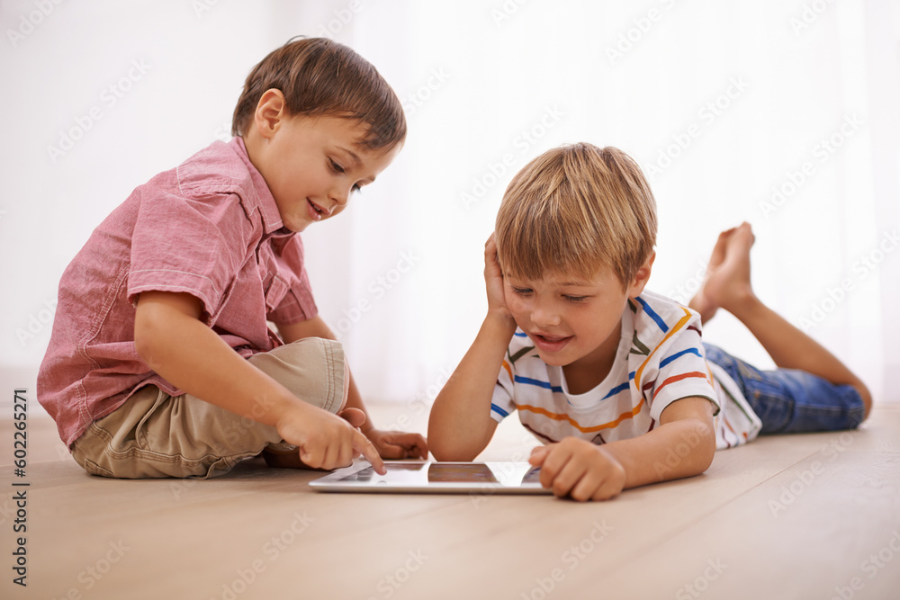 Learning, tablet and happy children playing together in family home for fun and education. Boy kids or friends on floor to play or streaming internet for development with mobile app, game and video Learning, tablet and happy children playing together in family home for fun and education. Boy kids or friends on floor to play or streaming internet for development with mobile app, game and video