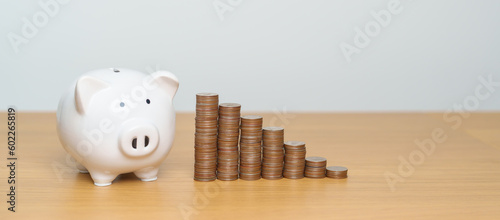 Money Saving for Future Plan, Retirement fund, Pension, Investment, Wealth Business and Financial concepts. coin with piggy bank on table, Money Counting and stack arrangement for deposit