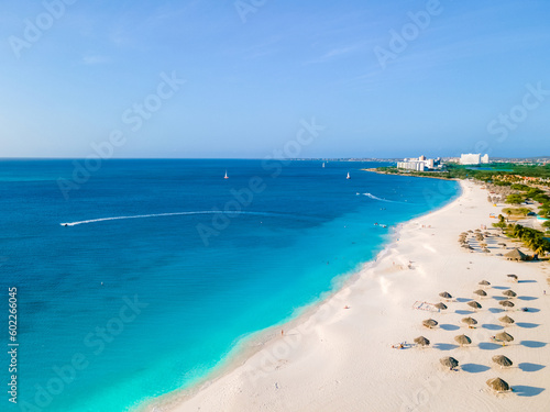 Eagle Beach Aruba, Palm Trees on the shoreline of Eagle Beach in Aruba, a aerial drone view at the beach © Chirapriya