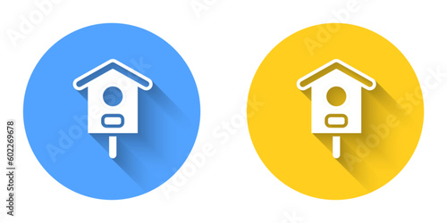 White Bird house icon isolated with long shadow background. Nesting box birdhouse, homemade building for birds. Circle button. Vector