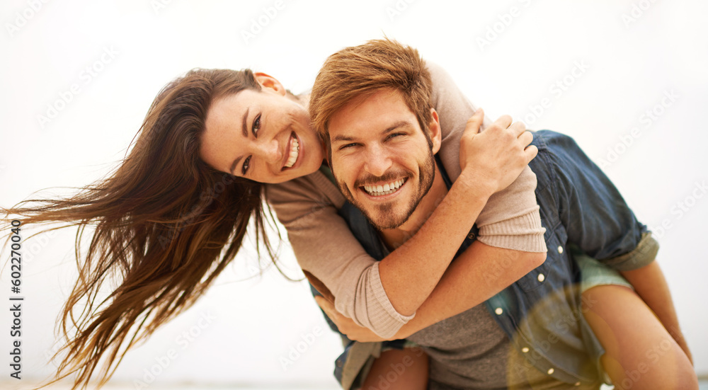 Love, hug and portrait of couple piggyback at beach, hug and laughing while bonding outdoor. Face, embrace and happy man with woman at the ocean for travel, freedom or vacation, holiday or Miami trip