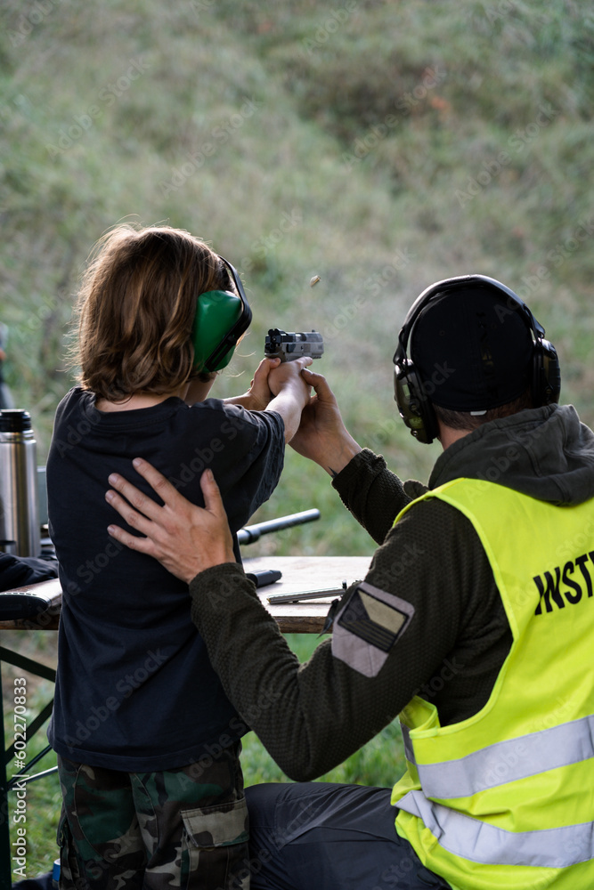 Training shooting weapons at an outdoor shooting range. Training shooting weapons at an outdoor shooting range.