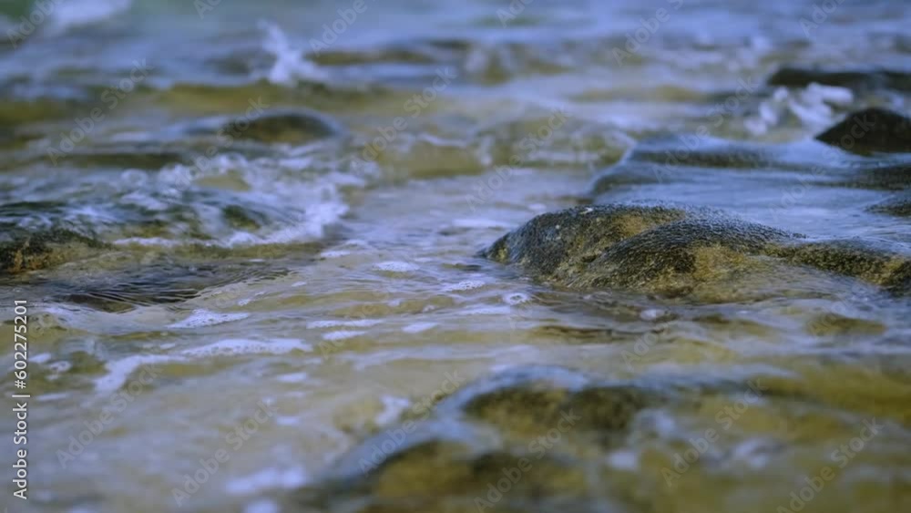 Sea water rippled into the rocky shore. Sea water rippled into the rocky shore.