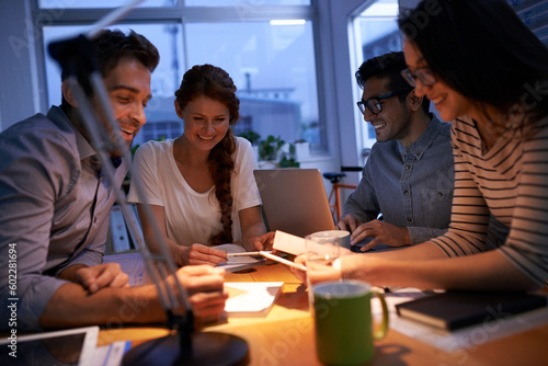 Teamwork, night and business colleagues working in the boardroom for planning, strategy or innovation. Meeting, collaboration and overtime with a team or group of employees at work in the evening