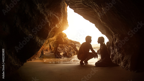 Portrait of happy couple, embracing in the hidden cave at the Querim beach, North Goa, India. photo