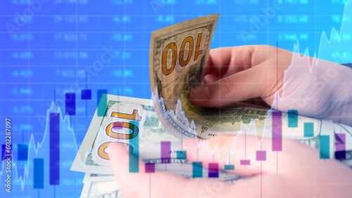 Hands with money on blue. D...