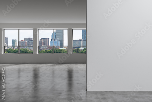 Panoramic picturesque city view of Boston at day time from modern empty room, Massachusetts. An intellectual and political center. Mockup copy space empty wall. Display concept. 3d rendering. © VideoFlow