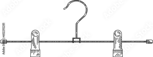 Metal coat hanger with clothespins in vintage engraved style. Sketch of coat hanger for trousers.