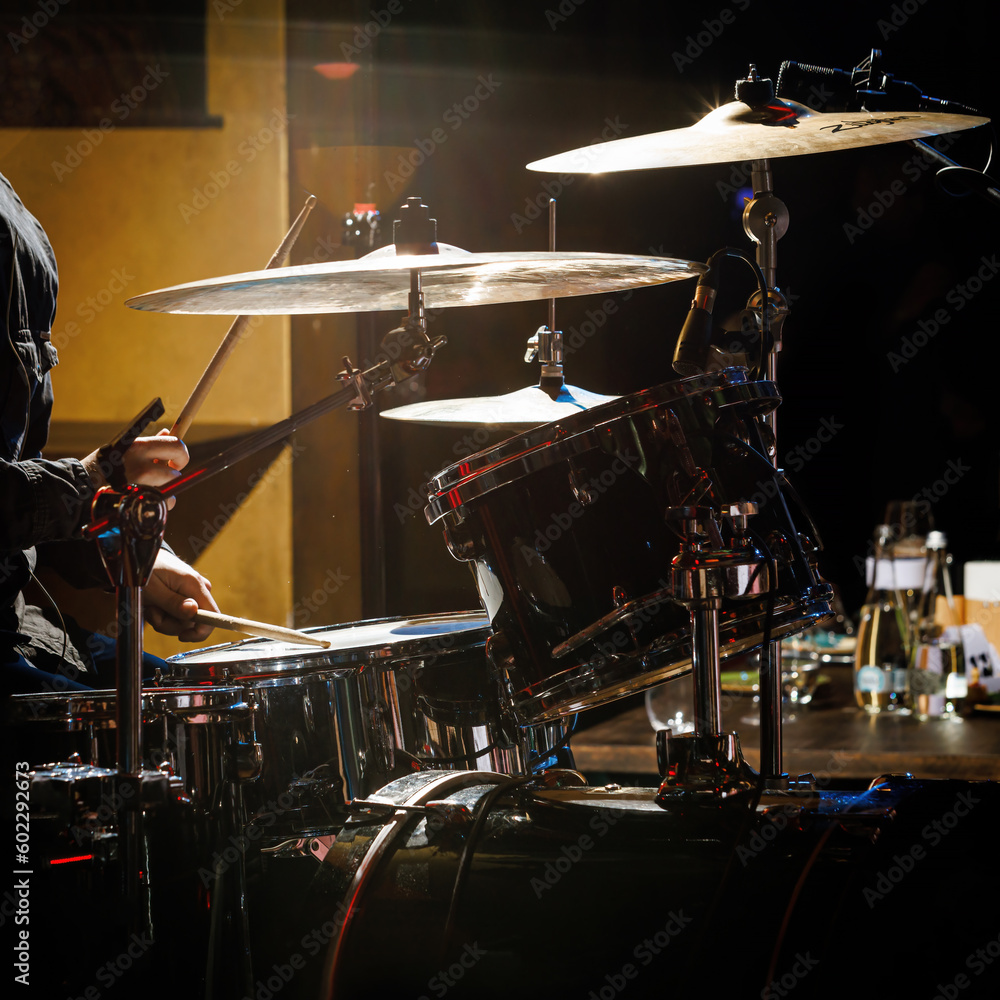 Fototapeta premium Close-up of drummer drumsticks with a drum set.
