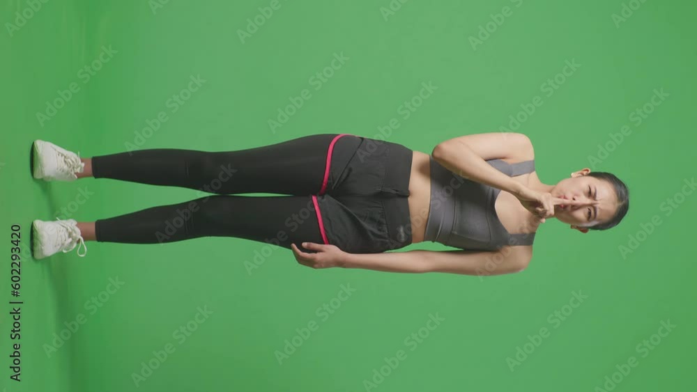 Full Body Of Asian Woman Wearing Sportswear And Making Shh Gesture Telling It Is A Secret On Green Screen Background In The Studio
Full Body Of Asian Woman Wearing Sportswear And Making Shh Gesture Telling It Is A Secret On Green Screen Background In The Studio