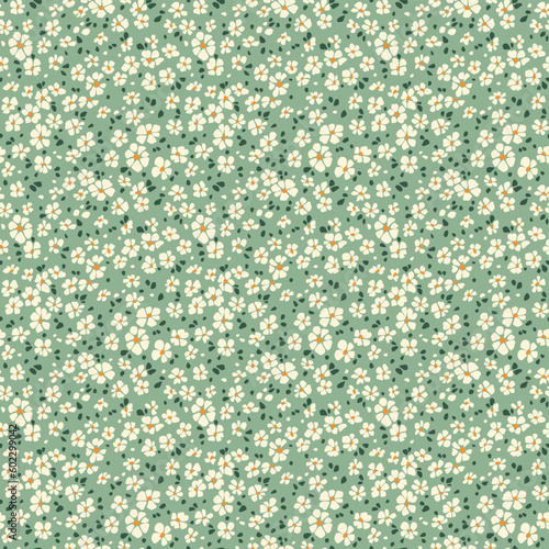 Vector seamless pattern. Pretty pattern in small flowers. Small white flowers. Green gray background. Ditsy floral background. Delicate template for fashion prints. Stock vector.