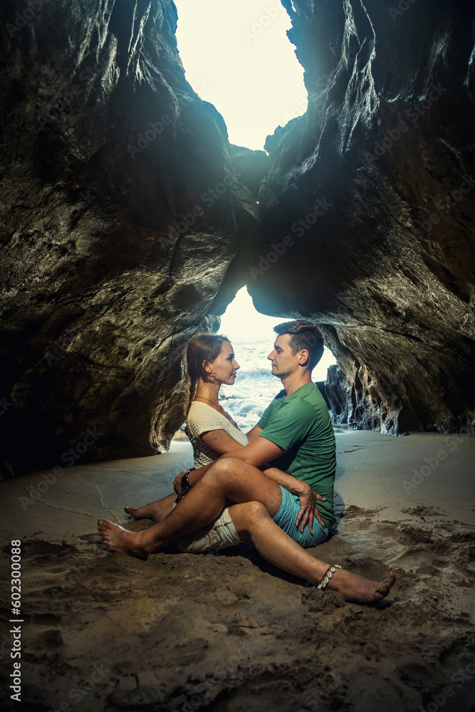 Portrait of happy couple in the hidden cave at the Querim beach, North Goa, India. Portrait of happy couple in the hidden cave at the Querim beach, North Goa, India.