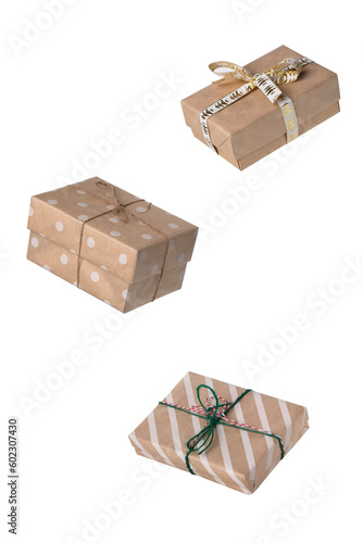 Gift boxes made of craft paper. Levitation, isolate. Holiday concept, gifts in eco-friendly packaging.