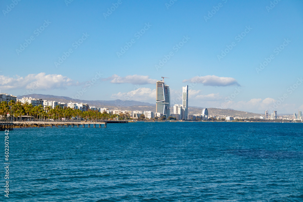 View of beautiful coast with promenade of Limassol, Cyprus from pier during spring sunny day.