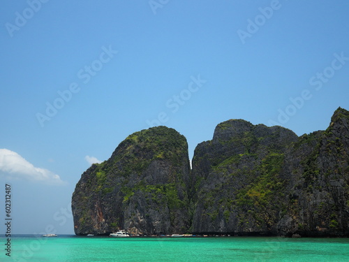 Sea view and bright turquoise color.  Tourist boats moored near Koh Phi Phi. Popular tourist destination with peaceful atmosphere. Maya Bay is located in Noppharat Thara Beach in Krabi Province, Thail © Vanchuree