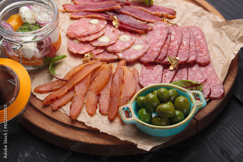 A large collection of appetizers from a variety of meats and sauces A large collection of appetizers from a variety of meats and sauces
