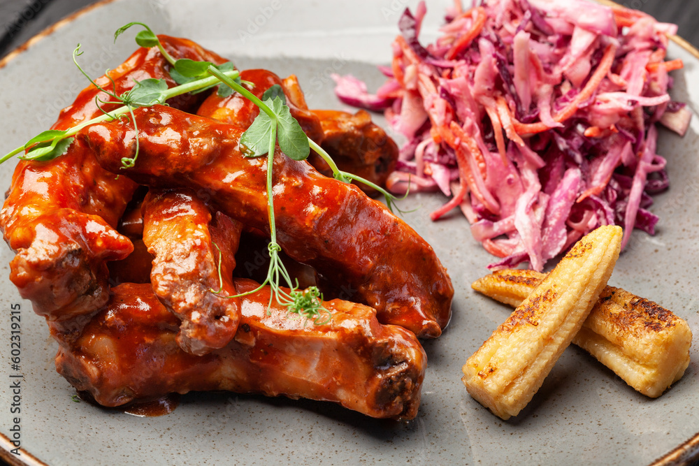 Fried juicy meat beef on a plate with sauce and spices Fried juicy meat beef on a plate with sauce and spices