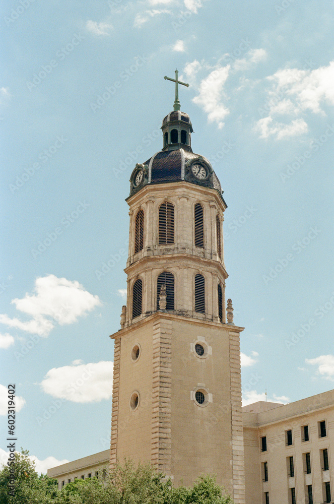 French Cathedral Bell Tower and Clock Tower in Lyon with Blue Sky Shot on Kodak Gold