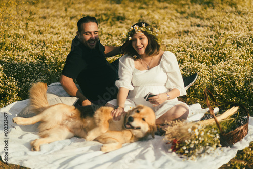 Pregnant woman and husband having picnic. © ardasavasciogullari