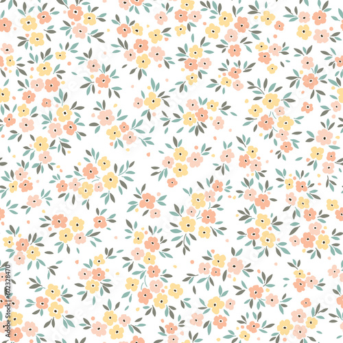 Cute floral pattern in small flowers. Delicate orange and yellow flowers. White background. Liberty print. Floral seamless background. Trendy template for fashion prints. Stock vector pattern.