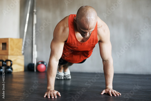Fitness workout, muscular and strong man doing push up for exercise, health performance or sports training for bodybuilding. Endurance challenge, determination or exercising person doing floor pushup