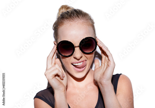 Portrait, tongue out and sunglasses or trendy woman for fashion in studio or positive and isolated on white background. Face, female model and crazy or smiling hipster or glamour and lipstick