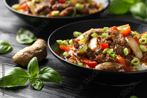 Stir fry Crispy Orange Beef with sweet peppers, onion and rice. Asian food