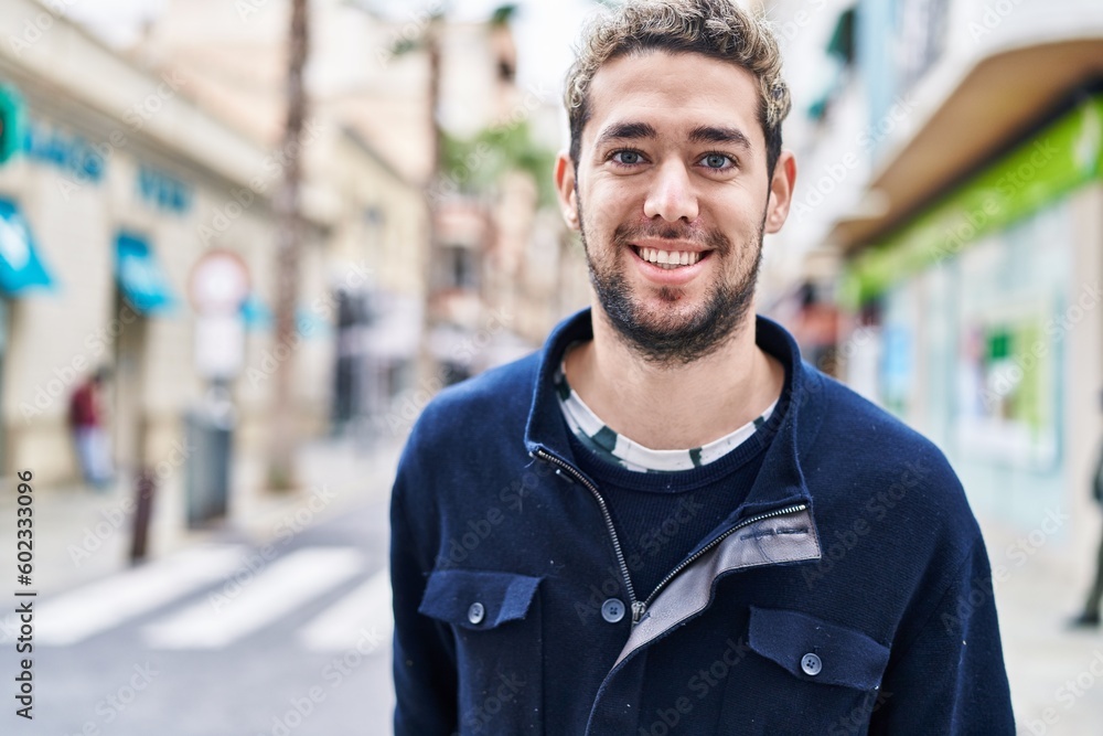 Young man smiling confident standing at street Young man smiling confident standing at street