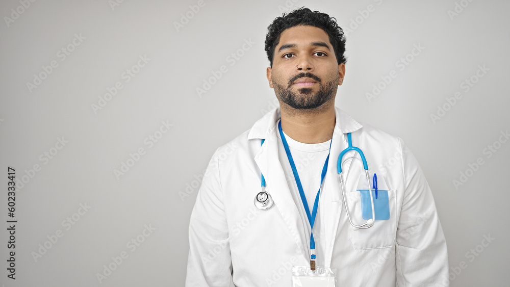 African american man doctor standing with serious expression over isolated white background African american man doctor standing with serious expression over isolated white background