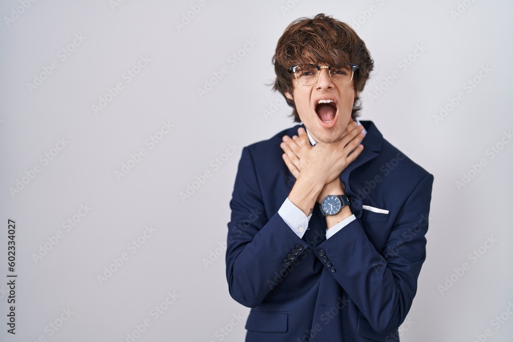 Hispanic business young man wearing glasses shouting suffocate because painful strangle. health problem. asphyxiate and suicide concept. Hispanic business young man wearing glasses shouting suffocate because painful strangle. health problem. asphyxiate and suicide concept.