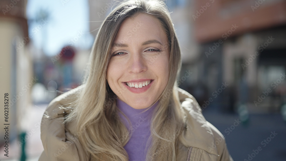 Young blonde woman smiling confident standing at street Young blonde woman smiling confident standing at street