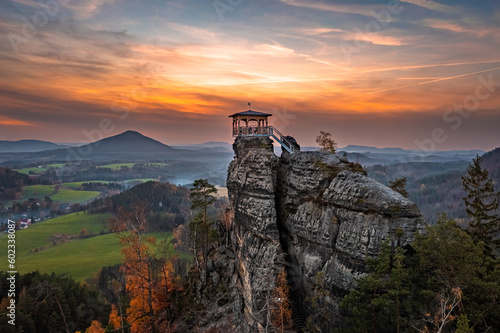 Jetrichovice, Czech Republic - Aerial view of Mariina Vyhlidka (Mary's view) lookout with a beautiful Czech autumn landscape and colorful golden sunset sky in Bohemian Switzerland region photo