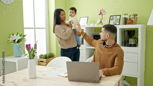 Couple and son taking care of son asking for silent working at home