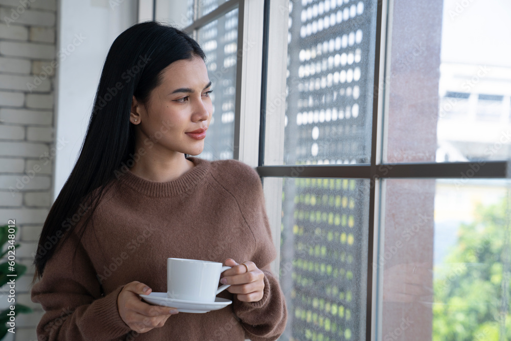 beautiful asian female drinking coffee at the morning beautiful asian female drinking coffee at the morning