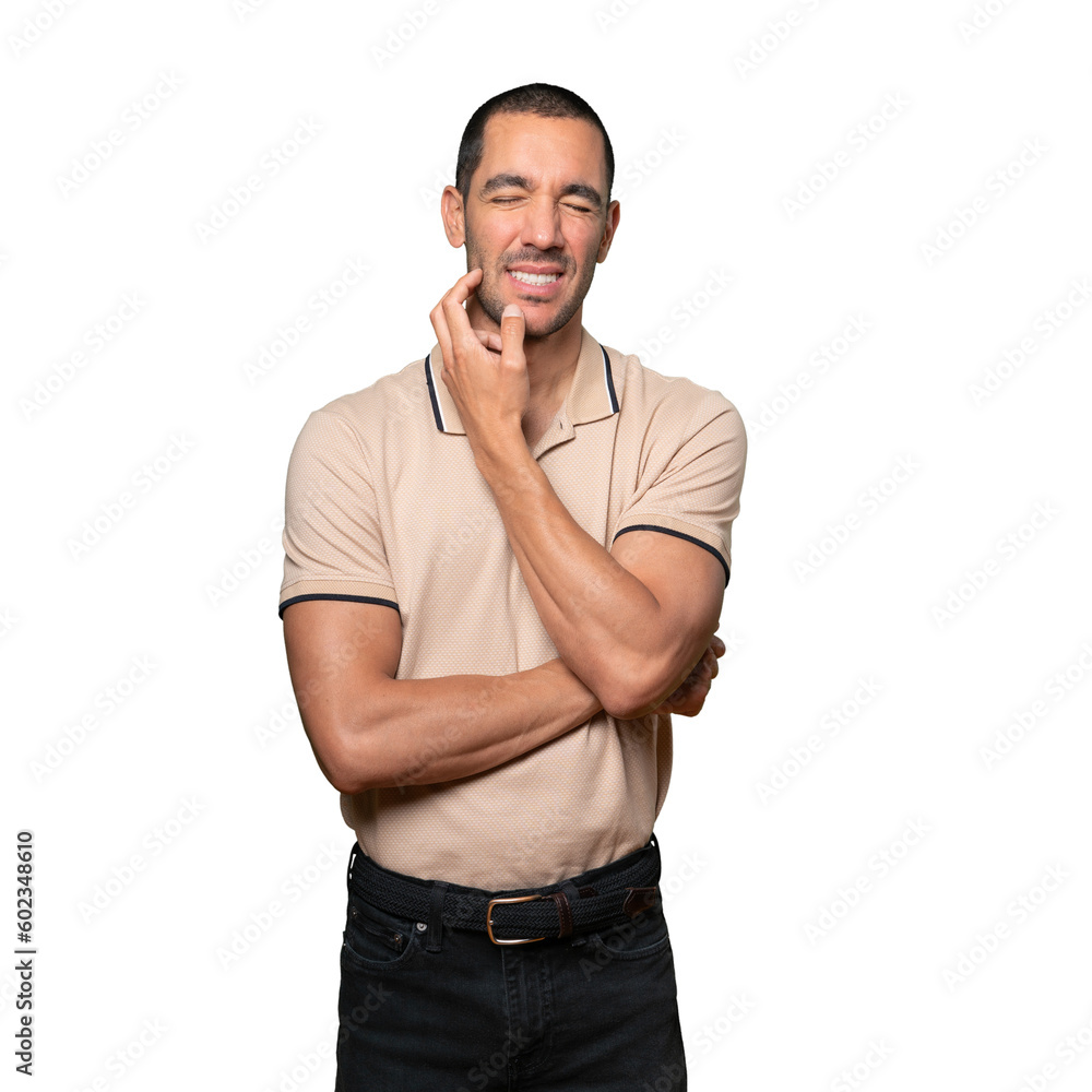 Concerned young man making a scratching gesture Concerned young man making a scratching gesture