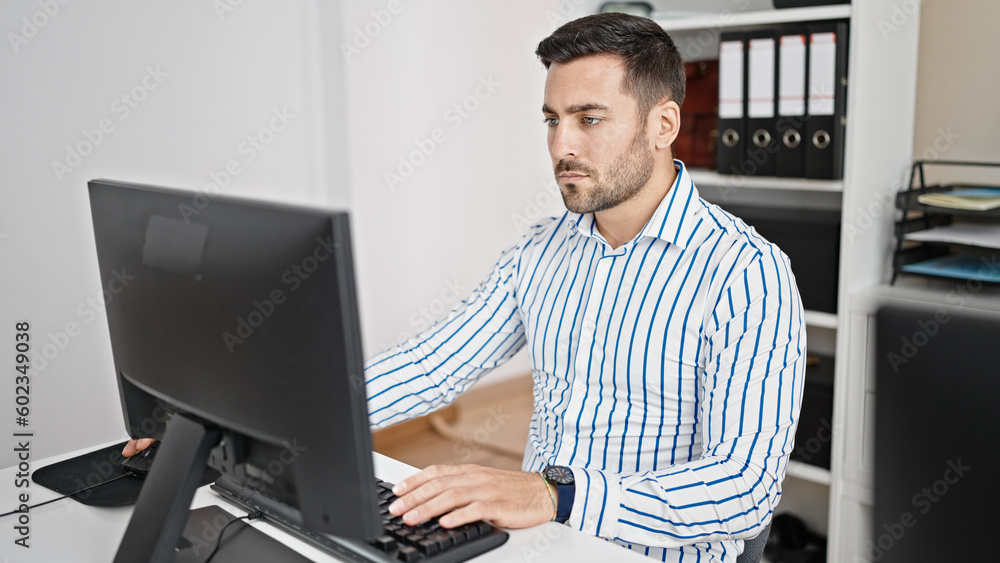 Young hispanic man business worker using computer working at office Young hispanic man business worker using computer working at office