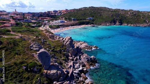 Italy summer holidays. Sardegnia island . village Santa Teresa di Galura in northern part with turquoise sea . aerial drone video photo