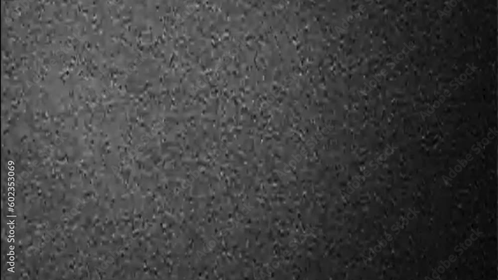 Old film glitch overlay grain noise. Black white real static distortion texture flicker motion grunge vintage cinema abstract background. Old film glitch overlay grain noise. Black white real static distortion texture flicker motion grunge vintage cinema abstract background.