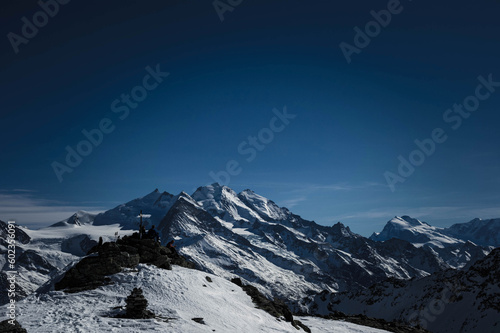 on the top of dreizentenhorn on swiss alps
