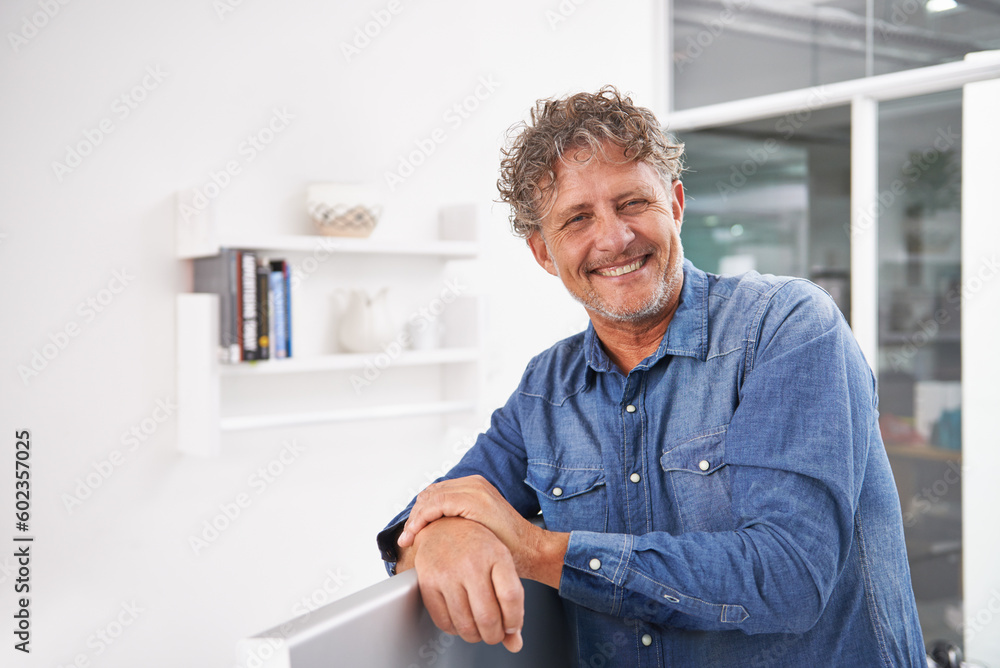 Portrait, smile and business man in office with pride for career or creative job. Entrepreneur, professional and male designer, confident boss and mature person from Australia leaning on computer.