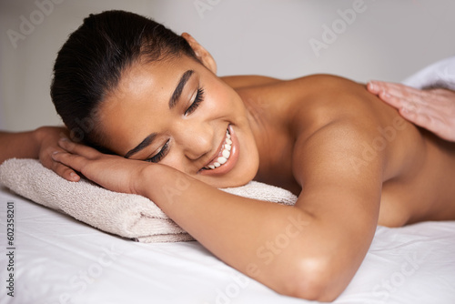 Happy girl, sleeping or hands for back massage in hotel to relax for zen resting or wellness physical therapy. Smile or woman salon for body healing treatment or natural holistic detox by masseuse