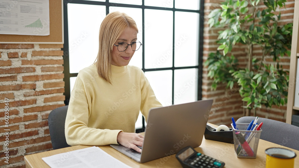 Fototapeta premium Young blonde woman business worker using laptop working at office