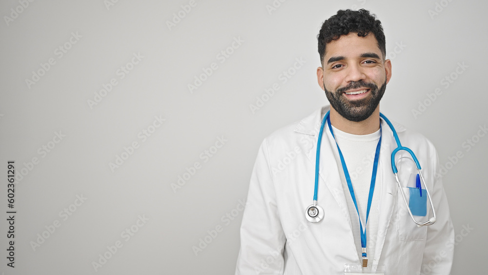 Young hispanic man doctor smiling confident standing over isolated white background Young hispanic man doctor smiling confident standing over isolated white background