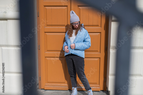Portrait of a stylish woman in blue jacket. Spring outdoor portrait. © olinchuk